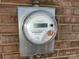 Close-up of a new smart meter installed on the brick home's exterior at 1216 Stallion Ln, Lancaster, SC 29720