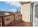 Charming wood balcony offering peaceful views of the neighborhood and blue skies at 127 High Ridge Rd, Mooresville, NC 28117