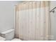 Shower with neutral colored curtain at 127 High Ridge Rd, Mooresville, NC 28117