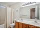 Bathroom featuring a double vanity, mirror, toilet, and bathtub at 127 High Ridge Rd, Mooresville, NC 28117