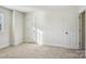 Neutral bedroom featuring carpet, base trim, and a window at 127 High Ridge Rd, Mooresville, NC 28117