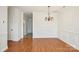 Dining room features hardwood floors, white trim, chandelier and hallway access at 127 High Ridge Rd, Mooresville, NC 28117