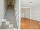 Foyer with staircase leading upstairs and a view into the dining room at 127 High Ridge Rd, Mooresville, NC 28117