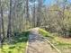 Winding walking path through a wooded area, offering a serene outdoor experience at 127 High Ridge Rd, Mooresville, NC 28117