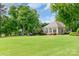 Expansive backyard with a well-appointed guest house and a basketball court at 18210 Pompano Pl, Cornelius, NC 28031
