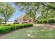 Well-maintained guest house surrounded by lush greenery and landscaping at 18210 Pompano Pl, Cornelius, NC 28031