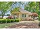 Charming guest house with a bright exterior and beautiful landscaping at 18210 Pompano Pl, Cornelius, NC 28031
