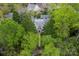 Aerial shot of stately home, showcasing its mature trees, landscaped yard, and proximity to neighborhood amenities at 1919 Kensal Ct, Charlotte, NC 28211