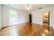 Spacious bedroom with hardwood floors and a connecting bathroom at 1919 Kensal Ct, Charlotte, NC 28211