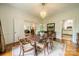 Inviting dining room with a chandelier, hardwood floors, and view into the kitchen at 1919 Kensal Ct, Charlotte, NC 28211