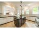 Bright kitchen with a large island, granite countertops, stainless steel appliances, and ample cabinet space at 1919 Kensal Ct, Charlotte, NC 28211