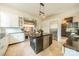 A spacious kitchen featuring stainless steel appliances, an island with bar seating, and lots of counter space at 1919 Kensal Ct, Charlotte, NC 28211