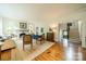 Comfortable living room featuring hardwood floors, fireplace, seating, staircase, and natural light at 1919 Kensal Ct, Charlotte, NC 28211