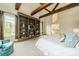 Spacious main bedroom with vaulted ceilings, exposed beams, and built-in shelving at 1919 Kensal Ct, Charlotte, NC 28211