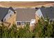 Aerial view showcasing the home's screened porch and backyard at 216 Portrait Way, Indian Trail, NC 28079