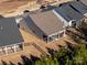 Aerial view of the house, highlighting the backyard and screened porch at 216 Portrait Way, Indian Trail, NC 28079