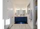 Elegant bathroom with double vanity, blue cabinets, and stylish flooring at 216 Portrait Way, Indian Trail, NC 28079