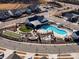 Community pool area with cabanas, fire pit, bocce ball, and putting green at 216 Portrait Way, Indian Trail, NC 28079