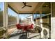 Relaxing screened porch with seating area, ceiling fan, and views of the backyard at 216 Portrait Way, Indian Trail, NC 28079