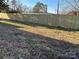 A tall, new wood fence ensures a private and secure backyard at 305 N White St, Lancaster, SC 29720