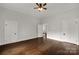 Spacious bedroom with hardwood floors and ceiling fan at 305 N White St, Lancaster, SC 29720