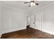 Spacious bedroom with hardwood floors and ceiling fan at 305 N White St, Lancaster, SC 29720