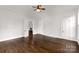 Large bedroom with hardwood floors and access to other rooms at 305 N White St, Lancaster, SC 29720