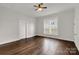Spacious bedroom featuring hardwood floors, a ceiling fan, and natural light from the window at 305 N White St, Lancaster, SC 29720