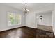 Bright dining room with hardwood floors and chandelier at 305 N White St, Lancaster, SC 29720