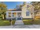 Charming yellow house with front porch and steps at 305 N White St, Lancaster, SC 29720