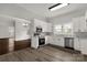 Modern kitchen with white cabinets, stainless steel appliances, and granite countertops at 305 N White St, Lancaster, SC 29720