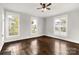 Living room showcasing hardwood floors and large windows at 305 N White St, Lancaster, SC 29720