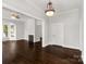 Living room with hardwood floors, fireplace, and natural light from the windows at 305 N White St, Lancaster, SC 29720