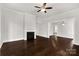Living room with hardwood floors, fireplace, and bright windows at 305 N White St, Lancaster, SC 29720