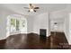 Living room boasting hardwood floors, fireplace, and natural lighting at 305 N White St, Lancaster, SC 29720