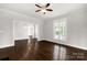 Hardwood floors and large windows in this living room at 305 N White St, Lancaster, SC 29720