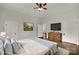 Main bedroom with hardwood floors and ceiling fan at 305 N White St, Lancaster, SC 29720