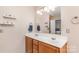 Bathroom with double sinks, a large mirror, and warm wood cabinetry at 4707 Hannah Dr, Rock Hill, SC 29732