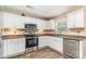 Well-lit kitchen featuring stainless steel appliances, white cabinets, and wood-look flooring at 4707 Hannah Dr, Rock Hill, SC 29732