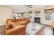 Inviting living room with fireplace, adjacent to the kitchen, featuring a ceiling fan and abundant natural light at 4707 Hannah Dr, Rock Hill, SC 29732