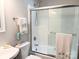 Updated bathroom with a tub and glass shower doors at 5105 Chelsey Ln, Monroe, NC 28110