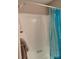 Bathroom with a shower/tub combo and blue shower curtain at 5105 Chelsey Ln, Monroe, NC 28110