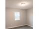 Bright bedroom featuring a large window and wood-look floors at 5105 Chelsey Ln, Monroe, NC 28110