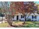 House exterior with landscaping and trees in fall at 5105 Chelsey Ln, Monroe, NC 28110