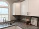 Kitchen corner with granite countertop and stainless steel sink at 5105 Chelsey Ln, Monroe, NC 28110