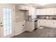 Modern kitchen featuring white shaker cabinets, granite countertops, and stainless steel appliances at 5105 Chelsey Ln, Monroe, NC 28110