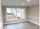 Sunroom with large windows and wood-look floors at 5105 Chelsey Ln, Monroe, NC 28110