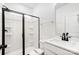 Clean bathroom with white vanity, black fixtures, and a glass shower at 5226 Verona Rd # 81, Charlotte, NC 28213