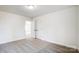 Spacious bedroom with grey carpet and double doors at 5226 Verona Rd # 81, Charlotte, NC 28213