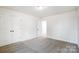 Spacious bedroom with grey carpet and double doors at 5226 Verona Rd # 81, Charlotte, NC 28213